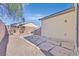 Small backyard with flagstone patio and gravel landscaping at 2812 Dotted Wren Ave, North Las Vegas, NV 89084