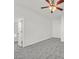 Spacious bedroom with grey carpet and ceiling fan at 2812 Dotted Wren Ave, North Las Vegas, NV 89084