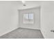 Simple bedroom with grey carpet and window with blinds at 2812 Dotted Wren Ave, North Las Vegas, NV 89084