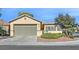 Single-story house with a two-car garage and landscaped front yard at 2812 Dotted Wren Ave, North Las Vegas, NV 89084