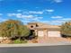 Single-story home with three-car garage and desert landscaping at 2837 Josephine Dr, Henderson, NV 89044