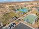 Aerial view of community amenities including tennis courts, basketball court, and playground at 2837 Josephine Dr, Henderson, NV 89044