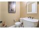 Elegant powder room with white vanity and ornate mirror at 2837 Josephine Dr, Henderson, NV 89044