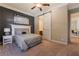 Bright bedroom featuring a barn door and ensuite bathroom access at 2837 Josephine Dr, Henderson, NV 89044