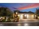 Stunning home exterior at sunset with landscaping and three-car garage at 2837 Josephine Dr, Henderson, NV 89044