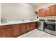 Laundry room with washer, dryer and ample counter space at 2837 Josephine Dr, Henderson, NV 89044