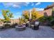 Cozy fire pit and seating area on brick patio at 2837 Josephine Dr, Henderson, NV 89044