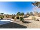 Landscaped backyard with a view of a golf course at 2905 Legend Dr, Las Vegas, NV 89134