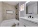 Updated bathroom with a bathtub, modern vanity, and grey tile at 2905 Legend Dr, Las Vegas, NV 89134