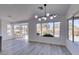 Dining area with hardwood floors and large windows at 2905 Legend Dr, Las Vegas, NV 89134