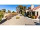 House exterior showcasing landscaping and golf course view at 2905 Legend Dr, Las Vegas, NV 89134