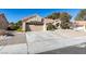 House exterior with attached garage and desert landscaping at 2905 Legend Dr, Las Vegas, NV 89134