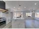 Modern kitchen with white cabinets, marble island, and high-end appliances at 2905 Legend Dr, Las Vegas, NV 89134