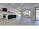 Modern kitchen with island and view to living room at 2905 Legend Dr, Las Vegas, NV 89134