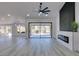 Bright and airy living room with sliding glass doors and fireplace at 2905 Legend Dr, Las Vegas, NV 89134