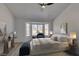 Main bedroom with bay window, ceiling fan and large closet at 2905 Legend Dr, Las Vegas, NV 89134