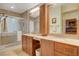 Double vanity bathroom with granite countertops, large mirror, and walk-in shower at 301 Salinas Dr, Henderson, NV 89014