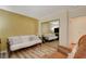 Bedroom with a futon and mirrored closet doors at 301 Salinas Dr, Henderson, NV 89014