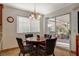 Cozy breakfast nook with a round table and view of the patio at 301 Salinas Dr, Henderson, NV 89014