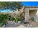 Landscaped walkway to entry with stone pathway and mature plants at 301 Salinas Dr, Henderson, NV 89014