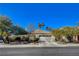 Single-story house with white garage door and desert landscaping at 301 Salinas Dr, Henderson, NV 89014