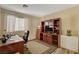 Home office with built-in shelving, desk, and comfortable chair at 301 Salinas Dr, Henderson, NV 89014