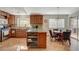 Kitchen with wood cabinets, granite countertop, and island at 301 Salinas Dr, Henderson, NV 89014