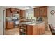 Spacious kitchen with granite countertops and ample wood cabinetry at 301 Salinas Dr, Henderson, NV 89014