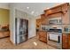 Modern kitchen boasts stainless steel appliances and tiled flooring at 301 Salinas Dr, Henderson, NV 89014