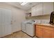 Laundry room with washer, dryer, and extra storage at 301 Salinas Dr, Henderson, NV 89014