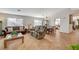 Spacious living room with tiled floors and a view of the dining area at 301 Salinas Dr, Henderson, NV 89014