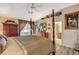 Main bedroom with a four-poster bed and access to the bathroom at 301 Salinas Dr, Henderson, NV 89014