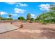 Landscaped backyard with stone pathway and desert landscaping at 319 Hidden Highlands Dr, Las Vegas, NV 89110