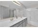 Bathroom with double sinks, shower, and tub at 319 Hidden Highlands Dr, Las Vegas, NV 89110