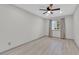 Bedroom with neutral walls, ceiling fan, and light-colored floors at 319 Hidden Highlands Dr, Las Vegas, NV 89110