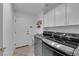 Laundry room with washer, dryer, and cabinets at 319 Hidden Highlands Dr, Las Vegas, NV 89110