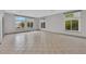 Bright living room with tile floors and multiple windows at 319 Hidden Highlands Dr, Las Vegas, NV 89110