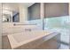 Relaxing bathtub with city views and modern fixtures at 3726 Las Vegas Blvd # 1002, Las Vegas, NV 89158