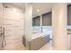 Bathroom with a walk-in shower and a modern, free-standing bathtub at 3726 Las Vegas Blvd # 1002, Las Vegas, NV 89158