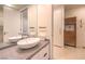 Bathroom with a sink, vanity, and access to closet at 3726 Las Vegas Blvd # 1002, Las Vegas, NV 89158