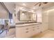 Elegant bathroom with double sinks, modern vanity, and a view into the bedroom at 3726 Las Vegas Blvd # 1002, Las Vegas, NV 89158