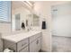 Clean bathroom with gray vanity and a mirror at 3772 Brilliant Sunset St, Las Vegas, NV 89129