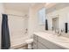 Bathroom with shower/tub combo and gray vanity at 3772 Brilliant Sunset St, Las Vegas, NV 89129