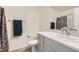 Clean bathroom with gray vanity, shower, and floral curtain at 3772 Brilliant Sunset St, Las Vegas, NV 89129