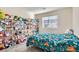 bedroom with teal bedding and toy storage at 3772 Brilliant Sunset St, Las Vegas, NV 89129