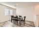 Dining area with wood floor and mid-century modern dining table and chairs at 3772 Brilliant Sunset St, Las Vegas, NV 89129