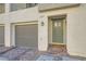 Townhome entry with modern door, brick walkway, and attached garage at 3772 Brilliant Sunset St, Las Vegas, NV 89129