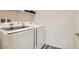 Laundry room with Samsung washer and dryer, and shelving at 3772 Brilliant Sunset St, Las Vegas, NV 89129