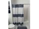 Bathroom with shower/tub combo and striped shower curtain at 3810 Wiggins Bay St # 203, Las Vegas, NV 89129