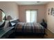 Spacious bedroom with large bed and plenty of natural light at 3810 Wiggins Bay St # 203, Las Vegas, NV 89129